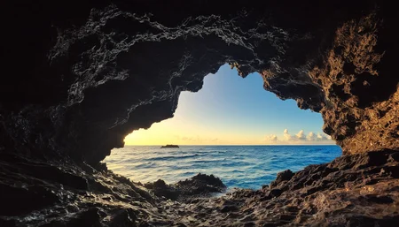 amazing photograph of gorgeous view, award winning, breathtaking, photo of the year, 4k, hyperrealistic, dramatic lighting <lora:Earth35_000010:0.4> <lora:Landscape_Unleashed:0.8>
The image captures a breathtaking scene of an underwater cave. The cave, with its dark and mysterious interior, is illuminated by the sunlight filtering through the top. Inside, the cave walls are adorned with various types of seaweeds, adding a touch of life to the otherwise inanimate environment. Outside, the ocean extends into the distance, its surface disturbed by small waves. The perspective of the photo is from within the cave, looking out towards the ocean, creating an interesting interplay between light and shadow. This image truly encapsulates the beauty and mystery of underwater caves.