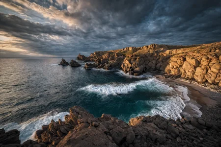 CINEMATIC SHOT, professional photo by Caravaggio of wild nature, Sachalin, cliffs, rock formations, sea waves, dramatic clouds, rule of thirds, view from surface, (by Christopher Nolan:1.4),F11,(DOF, Cinematic Color grading, intricate, hyper realistic, detailed, flickr, cinematic lighting) <lora:Wild_nature_XL:1>