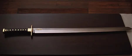 cinematic film still of  <lora:Kill Bill style:1>
From above, Cinematic film image of a large samuri sword with a black handle on a table,simple background,weapon,sword,grey background,gradient,gradient background,no humans,katana,black background,sheath,still life , Kodak film grain, dramatic light, dramatic shadow light, contrast, saturated color, cinematic, filmic, motion picture, realistic, realism, perfection, perfect, deep focus, clean image, Kill Bill style, Kill Bill Film Style, shallow depth of field, vignette, highly detailed, high budget, bokeh, cinemascope, moody, epic, gorgeous, film grain, grainy