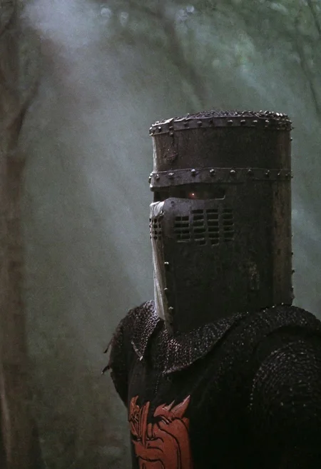 n-eeyblch, Dark Photo of creepy Vintage black Knight,
very detailed, atmospheric haze, Film grain, cinematic film still, shallow depth of field, highly detailed, high budget, cinemascope, moody, epic, OverallDetail, gorgeous, 2000s vintage RAW photo, photorealistic, candid camera, color graded cinematic, eye catchlights, atmospheric lighting, skin pores, imperfections, natural, shallow dof