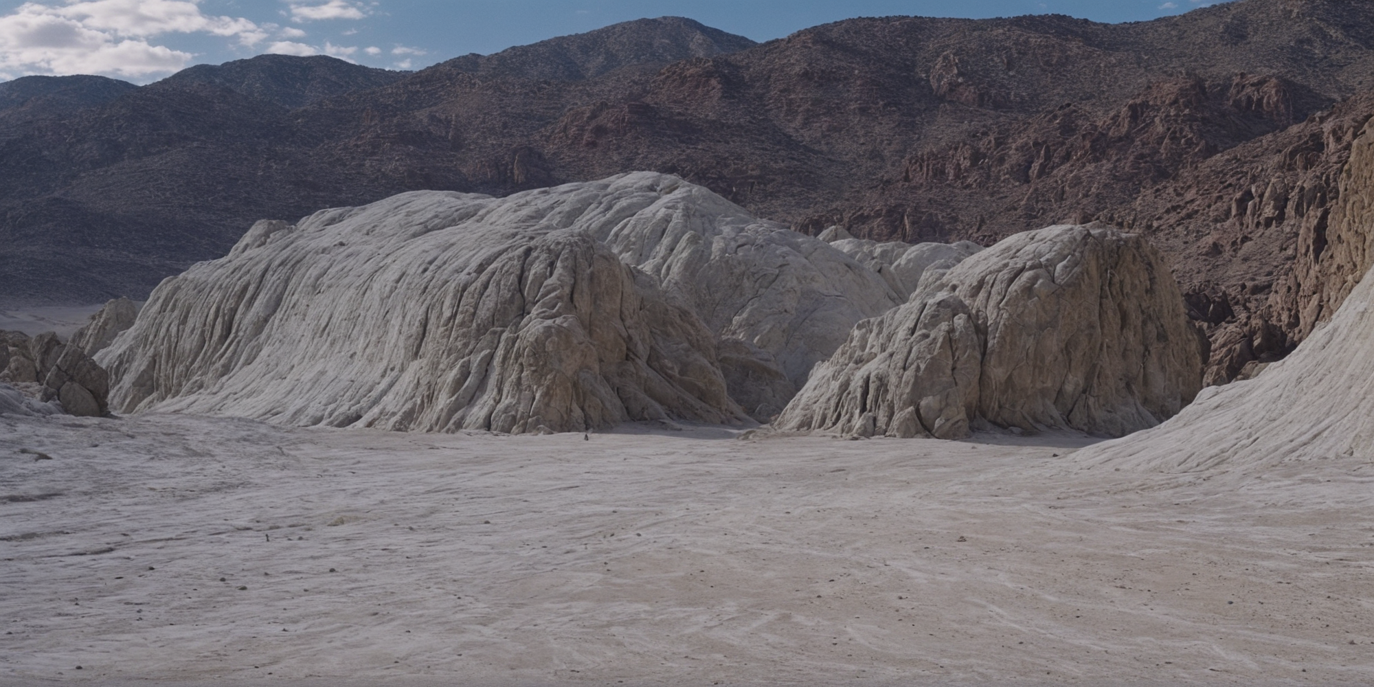 UHD, 4k, ultra detailed, cinematic, a photograph of  <lora:epic cinematic color style:1>
In "Neutral themed White color", a cinematic motion picture film of a large rock formation in the middle of a desert movie themed, sharp, detailed, epic cinematic color style, artistic creative color photography style, dramatic cinematic light style, cinematic dramatic color style, Kodak color film style, cinematic color motion picture film style, outdoors, sky, day, cloud, blue sky, no humans, cloudy sky, scenery, rock, sand, landscape, desert, mountain, cliff
, epic, beautiful lighting, inpsiring
