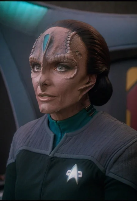 8k HDR, Cinematic film still portrait from blockbuster sci-fi science fiction movie, 35mm Fujifilm, IMAX, extremely detailed, female c4rd45514n alien, forehead crest, grey skin, ridges, scales, wearing (black and grey ds9st uniform, teal collar)