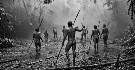 black and white photograph of few indigenous people hunting with spears and sticks in the amazonian rain forest, insane details, dramatic lights, high definition, 35mm camera, film photography style, heavy grain, ral-chrosc-bw, masterpiece, national geographic style, strong vignette, high contrast