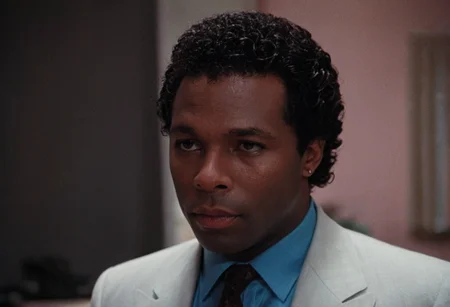 cinematic film still (Rico Tubbs), MiamiVice, indoors, office, closeup . shallow depth of field, vignette, highly detailed, high budget, bokeh, cinemascope, moody, epic, gorgeous, film grain, grainy