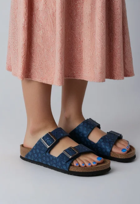 1girl, solo, simple_background, white_background, birksonfeet, blue_toenail_polish, close-up, lower_body, footwear_focus, patterned, long_skirt