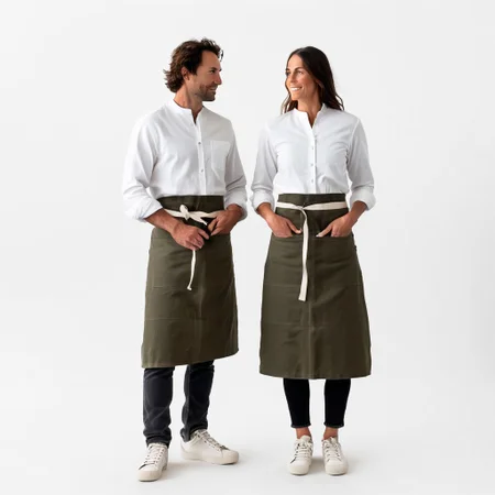 1man and 1woman, 30yo, white shirt, long sleeve buttondown, banded collar, grandad collar, woman with sleeves rolled, stockapron, olive canvas twill waist apron, natural webbing, black jeans, brown sneakers with dark gray midsole, white background, full body, <lora:juggernaut_cinematic:1.00>, <lora:more_art:0.40><lora:midjourney:0.15>