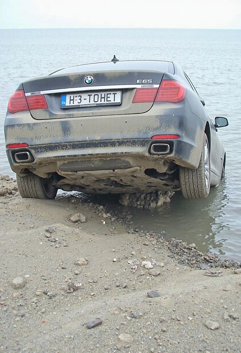 d1g1cam.
a photo taken from uphill of a dirty and worn vehicle, a visually damaged and slightly deformed 2009 BMW 7 E65 sedan with it's rear half dipped into the sea and the front half is tilted against seashore. Car is dirty with very thick layer of moist dust from below. Car is tilted upwards with front bumper above the water, but rear half of the car hidden under water surface. Cropped peek of bland ground cliff below the picture. Horizontal russian license plate with text "H3 T0HET".
<lora:Digicam:0.7>
