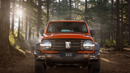 a gwm txxx parked in the middle of forest, sun light across the leaves, Tyndall effect, beautiful, hd, 8k, (photographic:1.5), magnificent, grandiose, mac os wallpaper <lora:GWMTank300_V2.0:1>