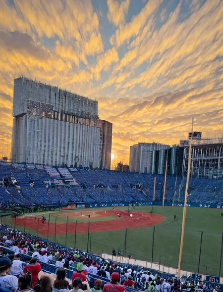 (1girl:1.5), (general:1.3), (detailed background:1.5), tokyo yakult swallows, baseball jersey, white jersey, red pinstripe pattern, dark blue baseball cap, dark blue undershirt, holding megaphone, happy, evening, BREAK
<lora:jingu_stadium:1> jingu stadium, outfield seats, stands, baseballfield, scenery, outdoors, audience, crowd, people, multiple boys, multiple girls, day, sunset, night, cloud, cloudy sky, sky, building, city, cityscape, skyscraper, sign, sun, blue sky, seats, BREAK
dramatic shadows, cinematic lighting, (photo background:1.1), (8K resolution:1.2), (masterpiece:1.2), best quality, amazing quality, very aesthetic, absurdres, newest, (ultra detailed:1.3), (uhd:1.1), <lora:cfg_scale_boost:0.7> <lora:Smooth_Booster_v2:0.5> <lora:StS-Illustrious-Detail-Slider-v1.0:3.0> BREAK