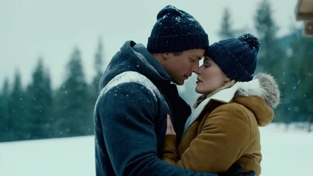 cinematic film still of <lora:Cinematic Film:1> Cinematic Film stock footage in (arri alexa style) Kodak film print, a man and a woman are embracing in the snow Cinematic Film Style, shallow depth of field, vignette, highly detailed, high budget, bokeh, cinemascope, moody, epic, gorgeous, film grain, grainy