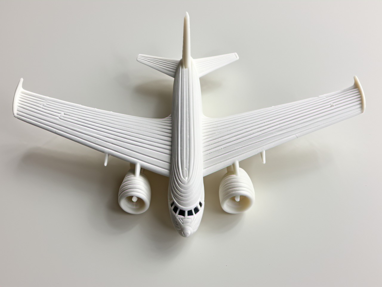 3D printed, print grooves, pla filament, <lora:3D_Printed_SDXL:1> airplane, simple background