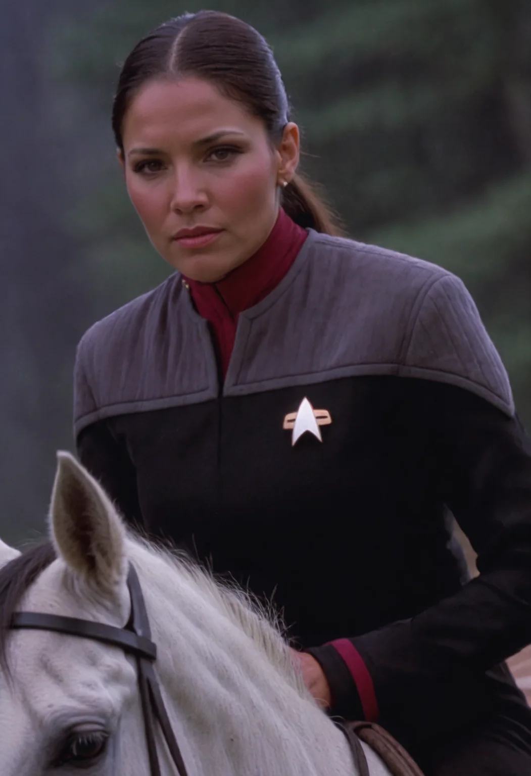 native american woman on a horse, in black and grey ds9st uniform,red collar, exquisite face, details, hands, ultimate details, breathtaking grandeur<lora:DS9XLVGRAD3:0.8>