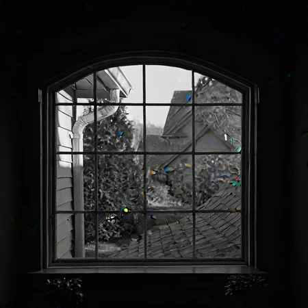 A tranquil view from inside a house, framed by an arched window with a grid pattern. The scene outside includes a neighboring house with beige siding, a sloping roof, and a white gutter. Lush greenery, including trees and shrubs, adds natural beauty. The lighting is soft and diffused, suggesting an overcast day. The image captures a peaceful suburban neighborhood, with the architecture and landscaping creating a harmonious, serene atmosphere. The depth of field emphasizes the window frame, creating a sense of intimacy and calm within the home.