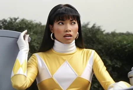 Trini wearing yellow power ranger catsuit, alone, long black straight hair tucked behind shoulders, bangs, helmetless, uniform, white turtleneck collar, white gloves belt, holstered weapon, large chunky steel hoop earrings, worried facial expression, sitting square-on, both arms very-outstretched, legs together, looking off-camera, in front of computer console on bridge of spaceship Starship Enterprise 1967, hyperdetailed photography