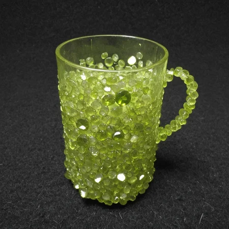 cup, made out of hud_per1d0t_wrld, green gem, glittering, fantastical, whimsical, <lora:peridot:1>