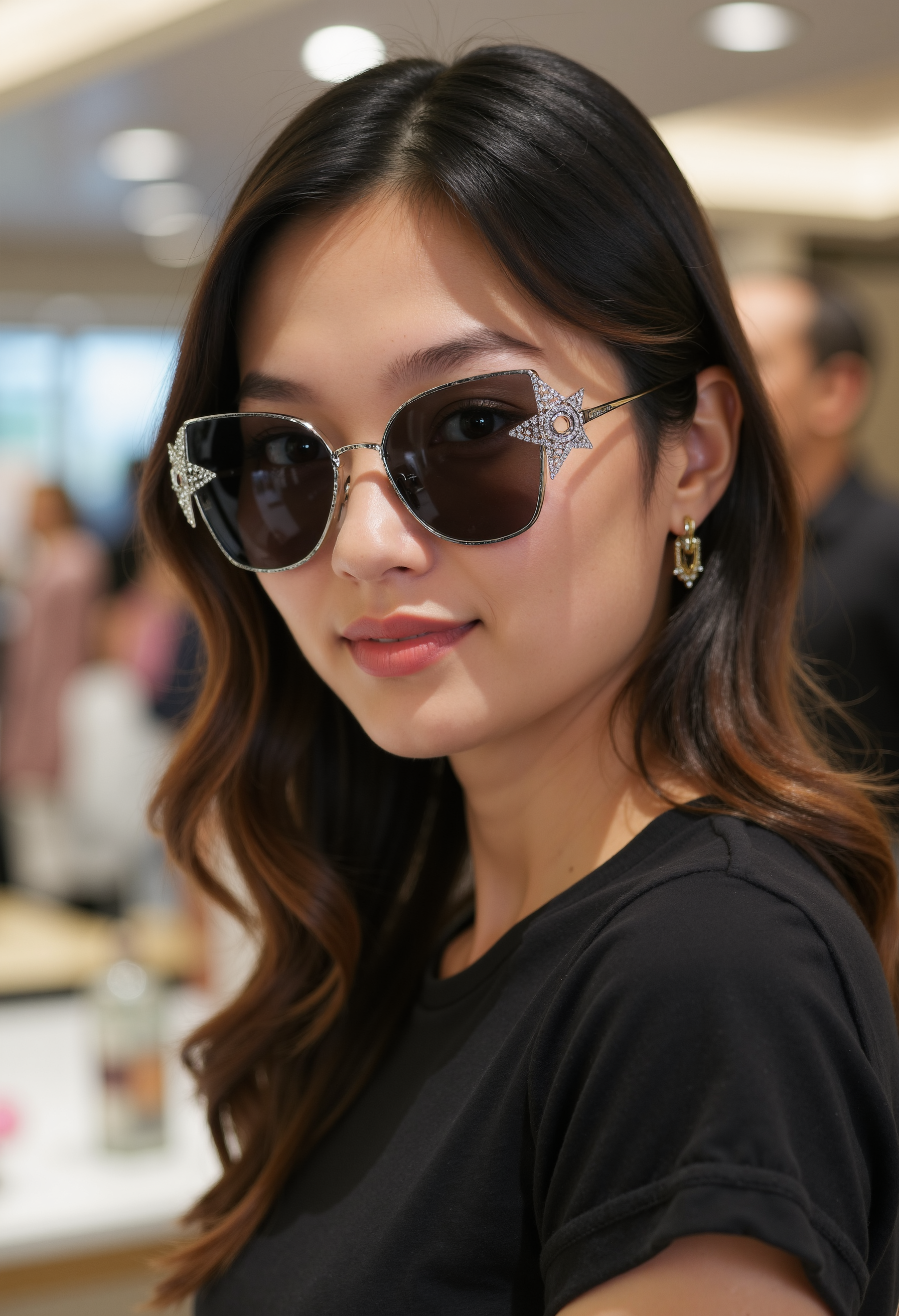 clo035, head shot of a asian woman, wearing a Christian Dior sunglasses with a metal frame and black lenses. The sunglasses have a star-shaped design. black t-shirt, looking in the camera, smiling, in a fashion store