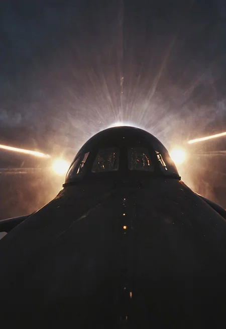 Create a vivid description capturing the essence of a close-up photograph inside the cockpit of a sleek, matte-black futuristic jet in flight. Highlight the discernible details: the pilot, confidently and mischievously smiling, with focused eyes locked onto the target. Convey a sense of high-speed motion, surrounded by billowing neon-pastel clouds, encapsulating the exhilarating and dynamic atmosphere within the cutting-edge aircraft.
very detailed, atmospheric haze, Film grain, cinematic film still, shallow depth of field, highly detailed, high budget, cinemascope, moody, epic, OverallDetail, gorgeous, 2000s vintage RAW photo, photorealistic, candid camera, color graded cinematic, eye catchlights, atmospheric lighting, skin pores, imperfections, natural, shallow dof,iran
