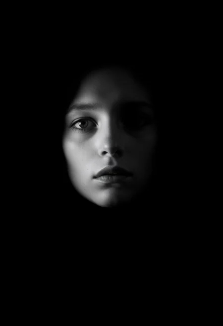 Create a hauntingly beautiful portrait of a face without a mouth, set against a stark, gradient-less black and white background that seems to absorb all sound, shot on the Hasselblad H6D-100c medium format camera paired with the HC 100mm f/2.2 lens. Employ a minimalist approach to lighting, using a single, softbox-mounted strobe to cast a subtle, Rembrandt-esque shadow on the subject's face, accentuating the curves and contours of their features, and evoking a sense of quiet contemplation and introspection. The overall aesthetic should be reminiscent of a charcoal sketch, with delicate, whispery textures and a focus on the expressive power of the eyes, which convey a sense of deep emotion or thoughtfulness, as if the subject is trapped in a world of silence, where their only means of communication is through the windows to their soul. <lora:add-detail-xl:1> <lora:WildcardX-XL-Detail-Enhancer:0.9> <lora:SDXLFaeTastic2400:0.085> <lora:MJ52:0.185> <lora:sinfully_stylish_SDKL:0.11> <lora:casting shadow style v2:0.1> casting shadow style, cucoloris patterned illumination