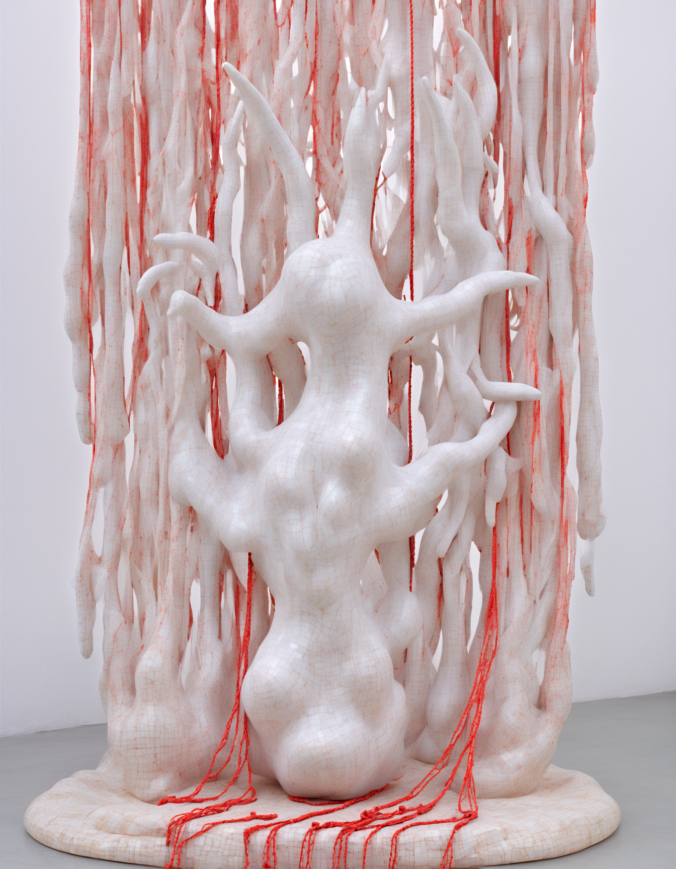 (she:1.05) alien as sculpture made of Delicate porcelain shards,geometric patterns ethereal fabric wisps, suspended in midair, ghostly whispers, fragmented memories, surreal elegance, ephemeral existence, haunting beauty, (colorful:1.1) , Architectural Digest Fashion Feature,red ropes,(Keresztes:1.2), hyperrealistic, photorealistic,