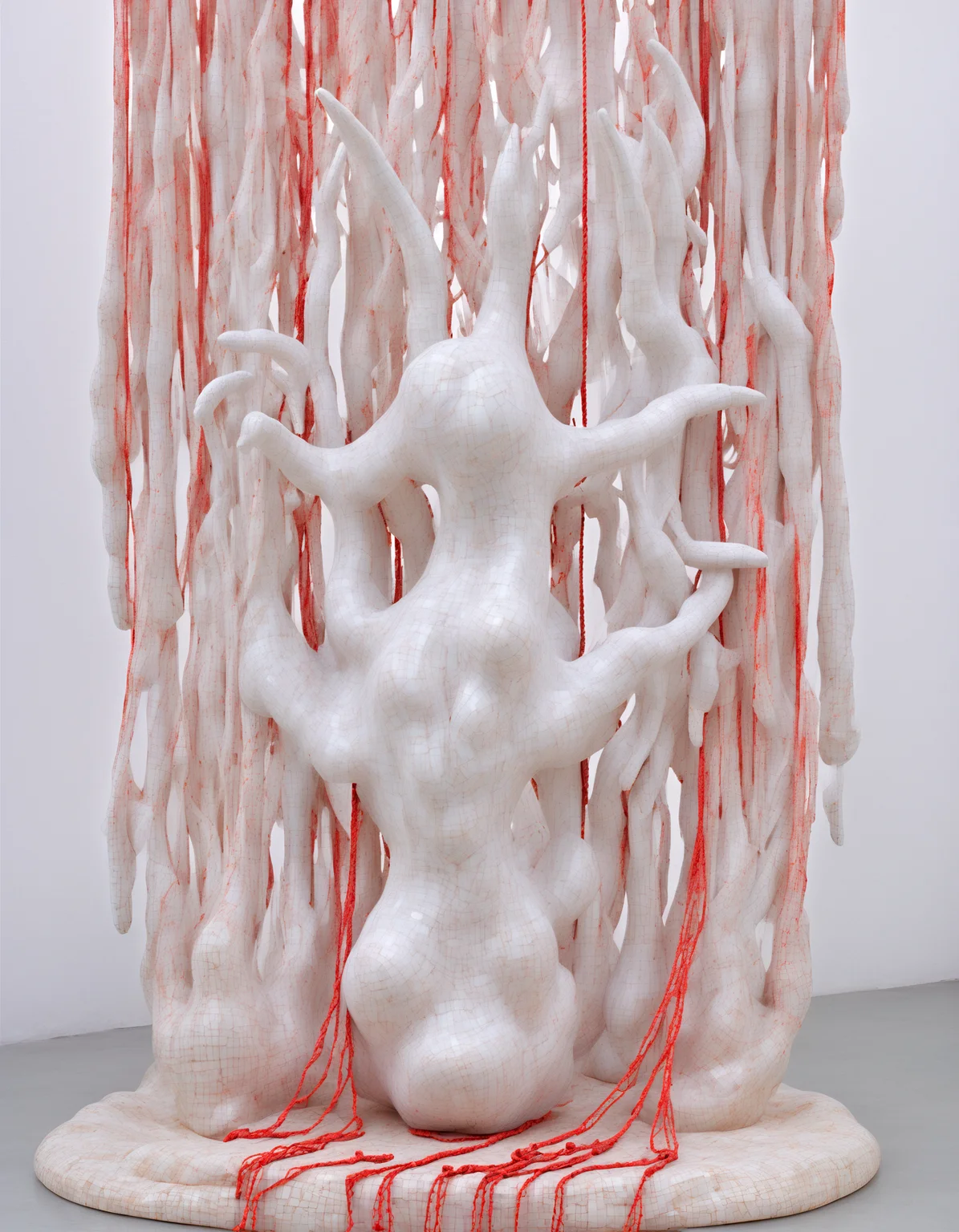 (she:1.05) alien as sculpture made of Delicate porcelain shards,geometric patterns ethereal fabric wisps, suspended in midair, ghostly whispers, fragmented memories, surreal elegance, ephemeral existence, haunting beauty, (colorful:1.1) , Architectural Digest Fashion Feature,red ropes,(Keresztes:1.2), hyperrealistic, photorealistic,