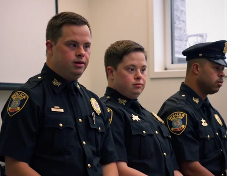 A still from the film "Police with Down Syndrome Academy 4" showing this years recruits graduating.