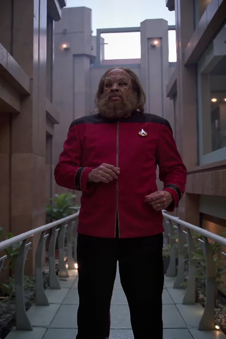tellarite with a beard and long hair in maroon TNGadm jacket with black shoulders and black pants standing on a glass bridge connecting two scifi buildings , detailed background Fantastic lighting. Detailed shadows.intricate details, vivid colors, hyper-detailed, ultra-sharp <lora:ST_TNG_ADMIRAL_FLUX><lora:tellarite_FLUX>