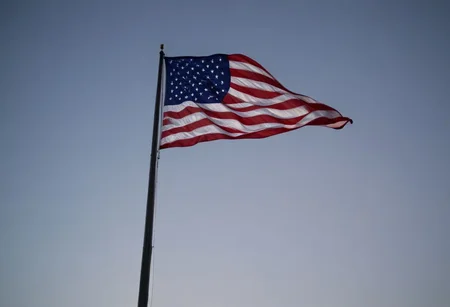 a photo of a ((us flag:1.2)) in spotlight flying at midnight on a flagpole, stunning fantasy scenery, low viewing angle, Highly detailed, high resolution, Cinematic lighting, inspirational, 4K resolution, 8K resolution, Artstation HD, Artstation HQ, Vivid, Vibrant, Ultra detailed, Octane render, dramatic, Iconic, (midnight lighting), sharp focus, photographed on a cannon EOS R5, Photo-realism,
