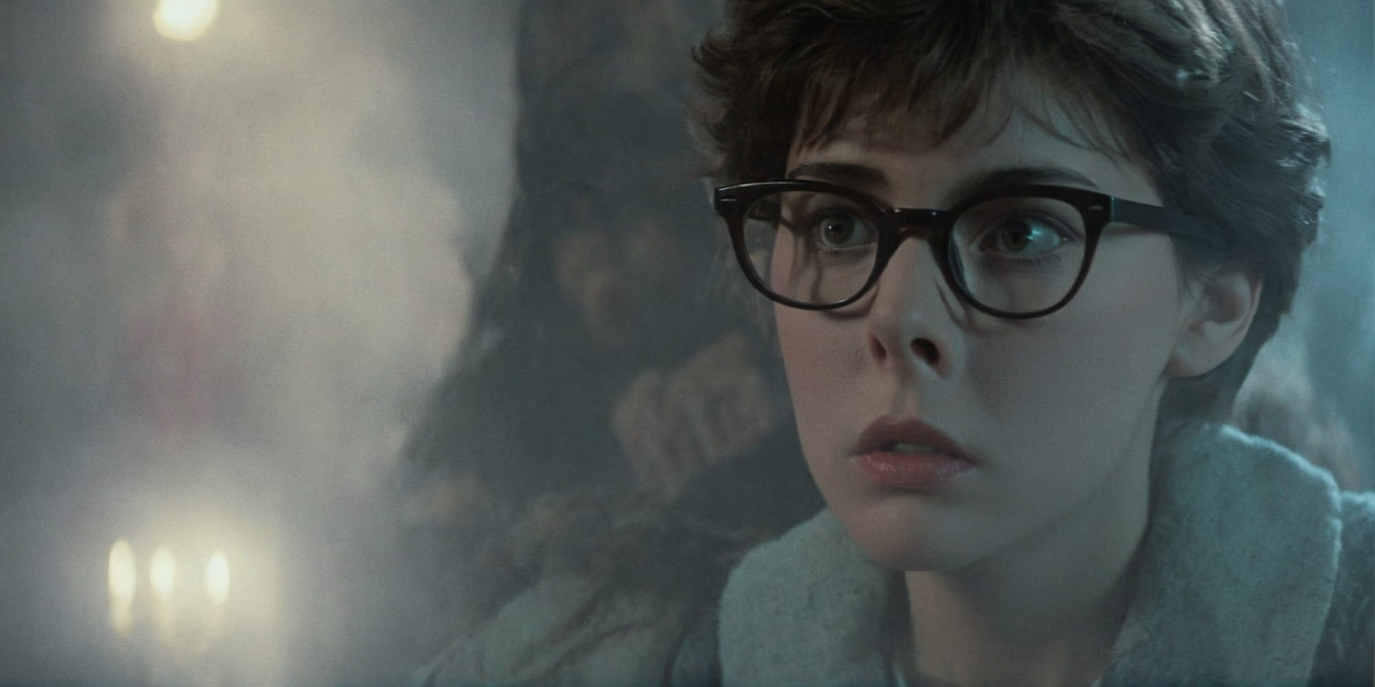 Horror-themed,  <lora:Fright Night 1985 Film Style:1>
Cinematic Closeup Shot Film Footage captured by Panavision Cameras and Lenses, Alex a nerd looking young woman with glasses staring at camera with a surprise look on her fac Fright Night 1985 Film Style, Eerie, unsettling, dark, spooky, suspenseful, grim, highly detailed