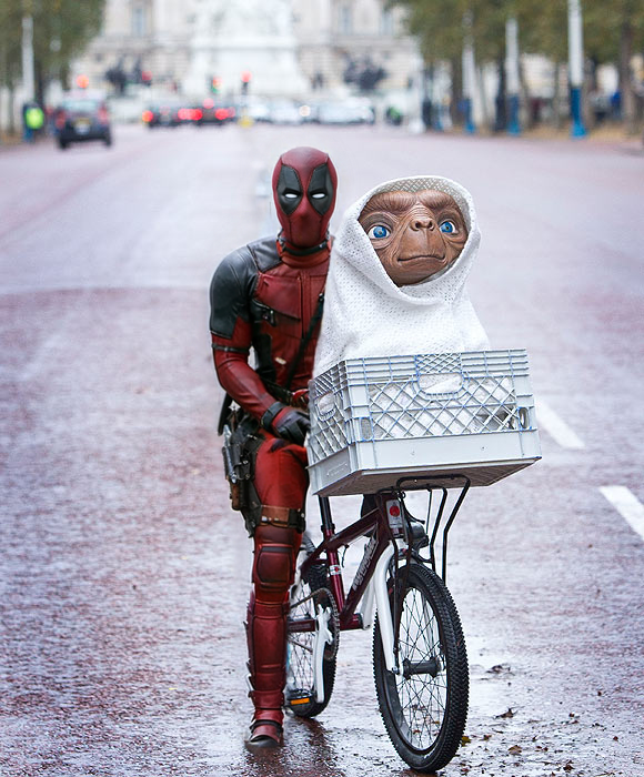 a boy on a bike  and a basket on the front of the bike, cinematic photo, Deadpool1024 . 35mm photograph, film, bokeh, professional, 4k, highly detailed <lora:Deadpool1024-000280:0.9>