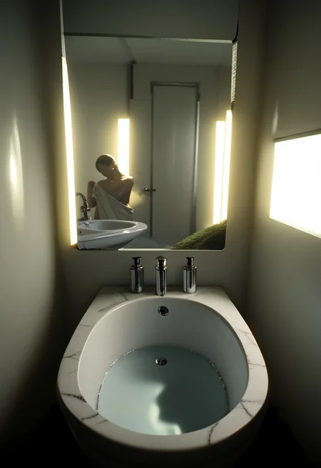 EnD_CyberFutureLandscape Style, futuristic bathroom, mirror, toilet, sink basin, specular highlights, side lighting, extreme light and shadow, cinematic lighting, cinematic angle, natural lighting, score_9, score_8_up, score_7_up, score_6_up, score_5_up, score_4_up,