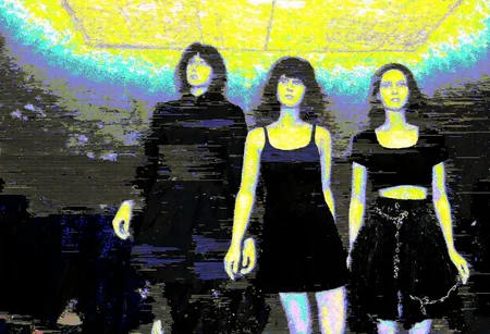 Circuit-bent/glitch art photograph showing a Mannequins standing in display window, three adult-sized figures with female features, smooth white surfaces, first wearing dark trench coat and black leggings and brunette wig, second in gothic attire dress and brunette wig, third in black loose crop top and black pleated gothic skirt with chains and brunette wig, no facial features, positioned closely, upward view angle, indoor retail environment, ceiling tiles visible, overhead lighting creating spotlight effect, subdued ambient lighting, possibly early evening or artificial lighting setting. dark background, centered composition, neon yellow and blue hues, horizontal noise pattern, slight pixelation, moderate digital corruption,