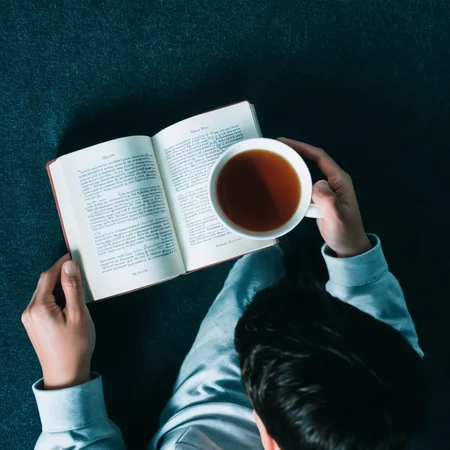 <lora:add-detail-xl:1>
<lora:detailed:0.3>
<lora:perfection style:0.3>
<lora:xl_more_art-full_v1:0.3>
<lora:Donnie Darko film style:1>
From above, a person holding a cup next to a book,1boy,holding,english text,cup,copyright name,pov,out of frame,tea , cinematic, film, Donnie Darko film style