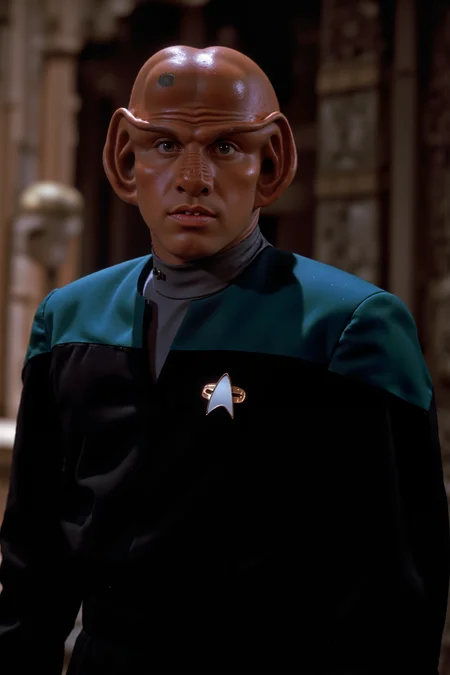 A ferengi stands in the ancient temple wearing black voyager uniform wiuth teal shoulders and grey undershirt (photography, high-resolution, dynamic, energetic,hyper-realistic, dramatic lighting, shallow depth of field.), detailmaximizer, MythP0rt<lora:midjourney_whisper_flux_lora_v01:0.55><lora:aidmaMJ6.1-FLUX-V0.1:0.4><lora:FluxMythP0rtr4itStyle:0.4><lora:detailed_flux_ntc:2.2><lora:aidmaImageUpgrader-FLUX-V0.1:0.65><lora:VOY_FLUX:1.1><lora:ferengiV1_FLUX>