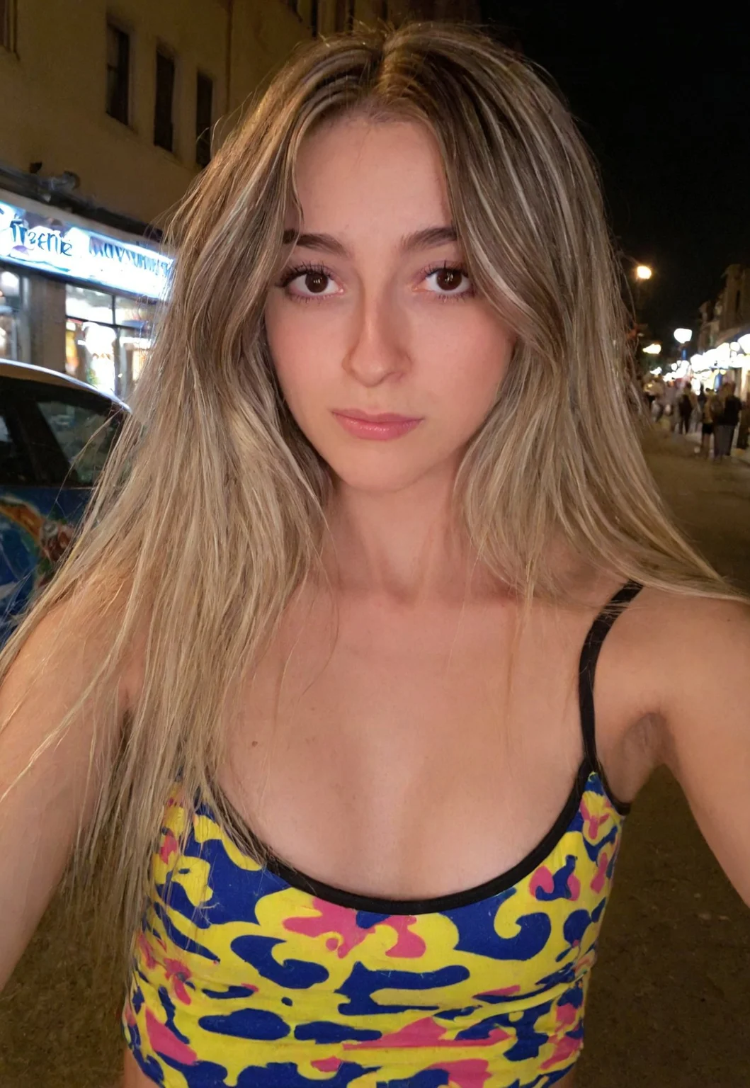 Masterpiece, detailed, realistic, photorealistic, negativeXL_D, sdxl_cyberrealistic_simpleneg, 1girl, detailed face, cute, street background, mid twenties, small breasts, rave clothes, long hair, blonde highlights,