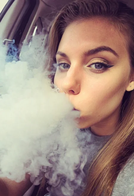 <lora:VapeXL-08:1.0> VapeXL, girl blowing smoke, selfie