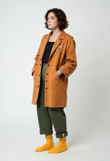 (realistic photograph of woman), 1girl, solo, simple_background, white_background, scksnsndls, patterned red and yellow socks, green trousers, orange and brown coat, short_hair, looking_away, full_body, (birksonsocks, birkenstock)