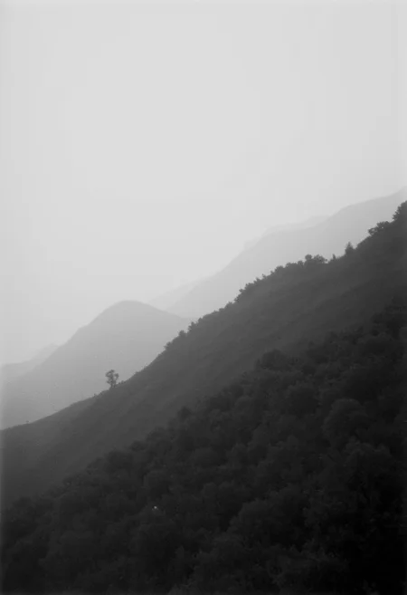 KB_AgfaCA20_FLUX, instagram photo a foggy mountain, lord of the ring-style,  film grain, soft shadow