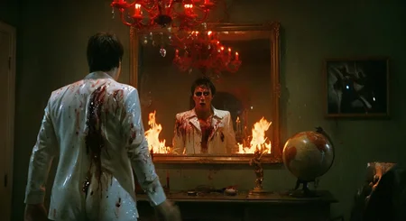 surreal horror fantasy frame, tony montana, wearing a sweat-drenched white disco suit torn at the shoulders, his face half-lit by flame and half-obscured in black ash, silently confronting a mirror that reflects a demonic version of himself with hollow eyes and horns, standing motionless with arms slightly raised, wide shot, static eye-level angle as if captured on old VHS footage, the room is a hellish, decayed version of his Miami office—blood dripping from the globe sculpture, distant screams echoing, tense and hallucinatory mood, minimal flickering light from a swinging red chandelier, decayed gold and sickly green palette, inspired by found-footage horror and psychological nightmare cinema
