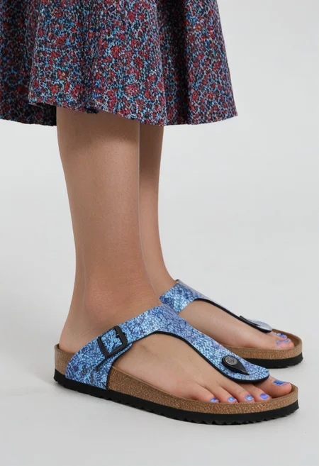 1girl, solo, simple_background, white_background, gizehonfeet, blue_toenail_polish, close-up, lower_body, footwear_focus, patterned, long_skirt