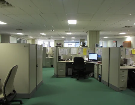 90s office room with hundreds of cubicles as far as the eye can see, green carpet, fluorescent lighting,  uneasy ambiance 
  <lora:amateurphoto-6version:1>   <lora:Dark Cinematic:1> DRK