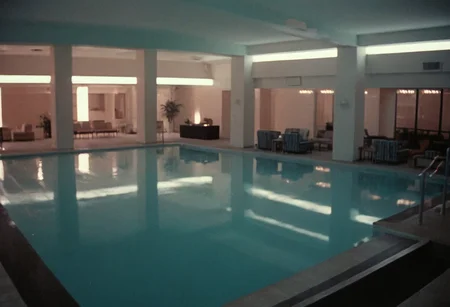 analog film photo MiamiVice, CineShining, indoors, Overlook Hotel . faded film, desaturated, 35mm photo, grainy, vignette, vintage, Kodachrome, Lomography, stained, highly detailed, found footage