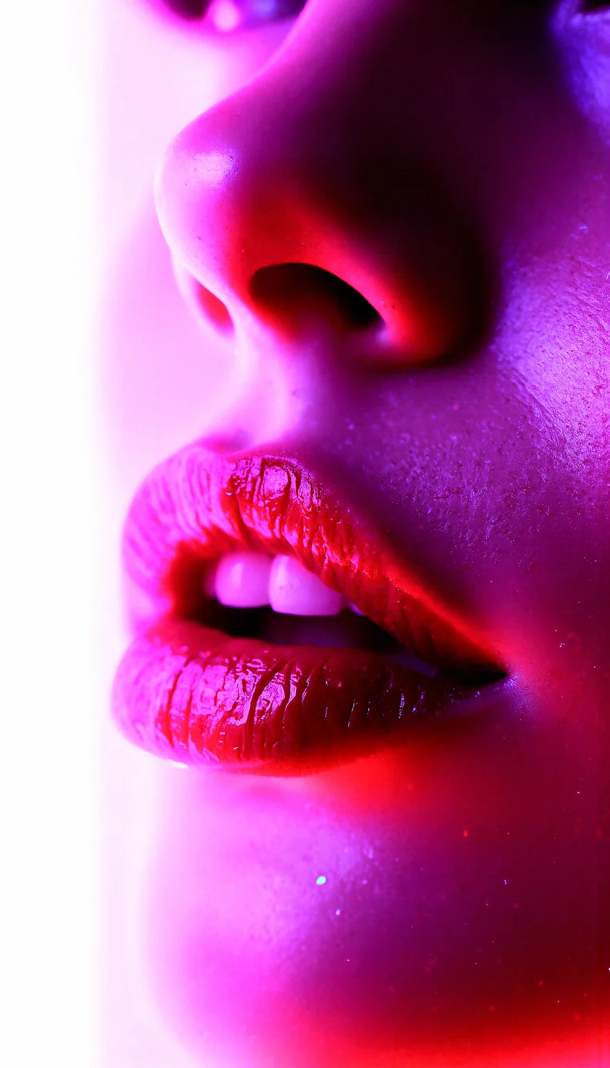 Neon-lit close-up, A hyper-realistic close-up of a woman’s glossy lips and face, bathed in neon pink and purple light with glittering particles on her skin. Light reflecting off glossy surfaces, creating bright highlights and enhancing texture.A moist, dewy skin texture that enhances the glossiness and reflects light.Sharp, detailed lines on the lips, enhancing their shape and gloss.Visible pores that add a touch of realism to the hyper-realistic image.