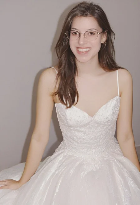 realistic photo of Beautiful young woman, perfect medium perky natural breasts, 2009 style, low rise, low contrast style, 8mm film, analog photography style, long brown hair, sharp facial features,thick nerdy glasses, pale white skin, , influencer, brown eyes, no makeup, instagram, detailed skin texture, detailed eyes, detailed face, slim, (small waist, wide hips, thick thighs:1.2), (sexy wedding gown with pink highlights:1.3), happy, smiling, juicy ass,