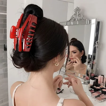 1girl, solo, nape, black hair, hair claw, tying hair, red hairclaw, mirror, make up, look from mirror,