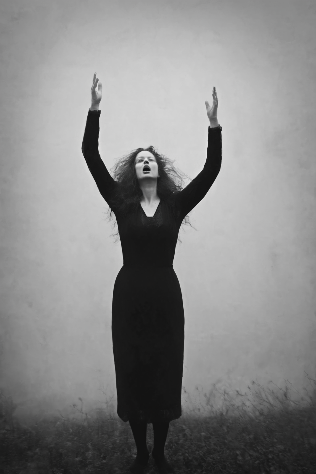 <lora:Photographer Maren Klemp Style:1>Photographer Maren Klemp Style - a black and white photo of a woman with her hands up in the air