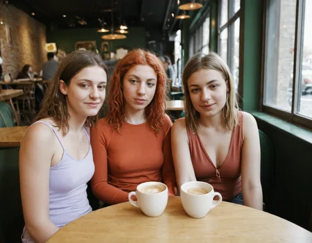multipeoplelora, 3women, sitting at table in coffeeshop, portrait