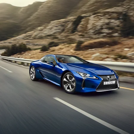 realistic photo of a lexuslc car on the road, realistic, <lora:LexusLC_SDXL_v1:1>