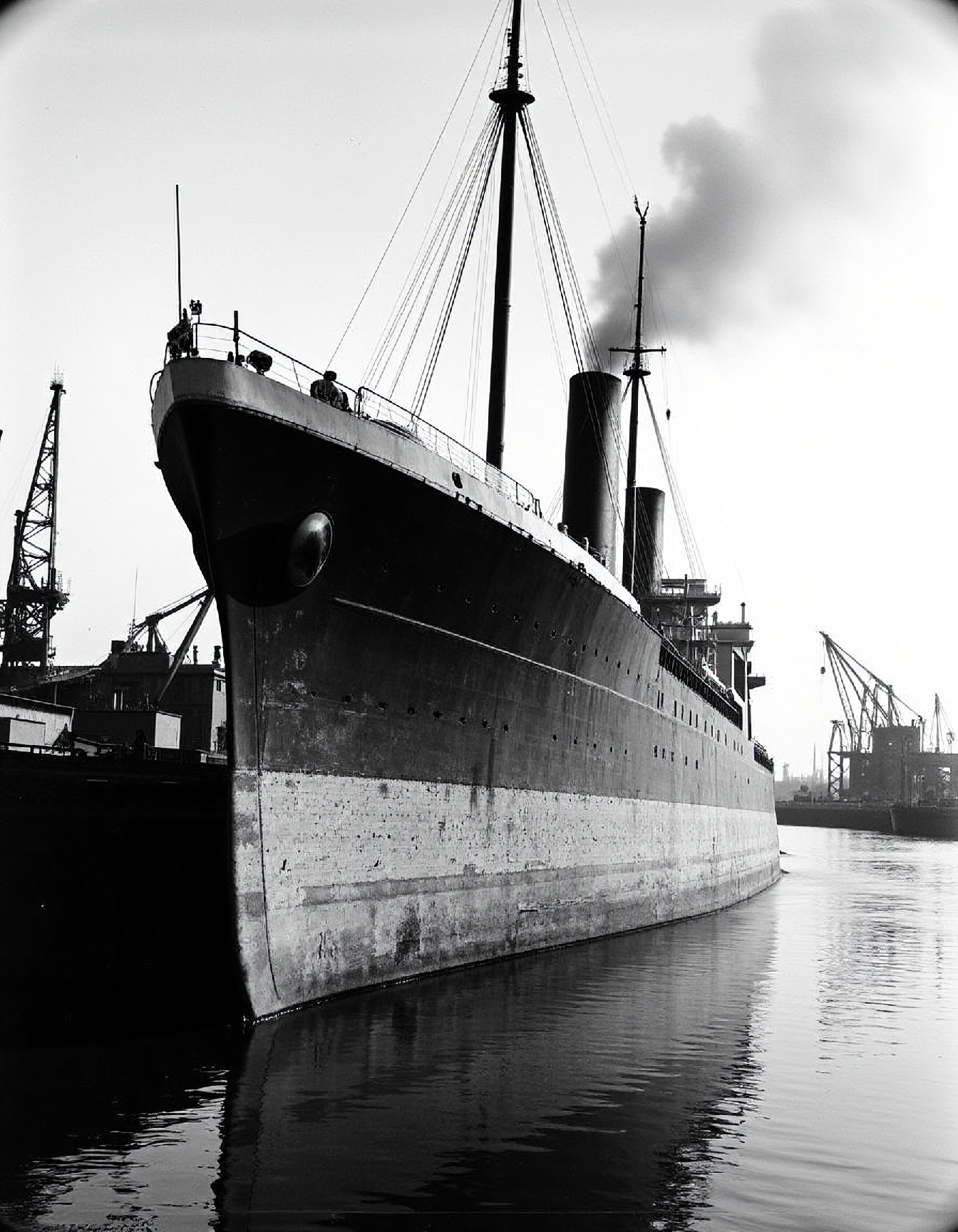 robert doisneau style. A weathered cargo ship, its hull scarred and chipped, sits majestically in a bustling harbor.  The image is captured in sharp, high-contrast greyscale, with dramatic lighting highlighting the ship's imposing size.  Smoke billows from the ship's funnel, casting a hazy veil over the surrounding port.  Cranes and other vessels fill the background, adding to the sense of a vibrant maritime scene.  The overall composition evokes a sense of industry and adventure, characteristic of the 1940s era.  The photograph is framed by a subtle vignette, emphasizing the ship as the focal point.
