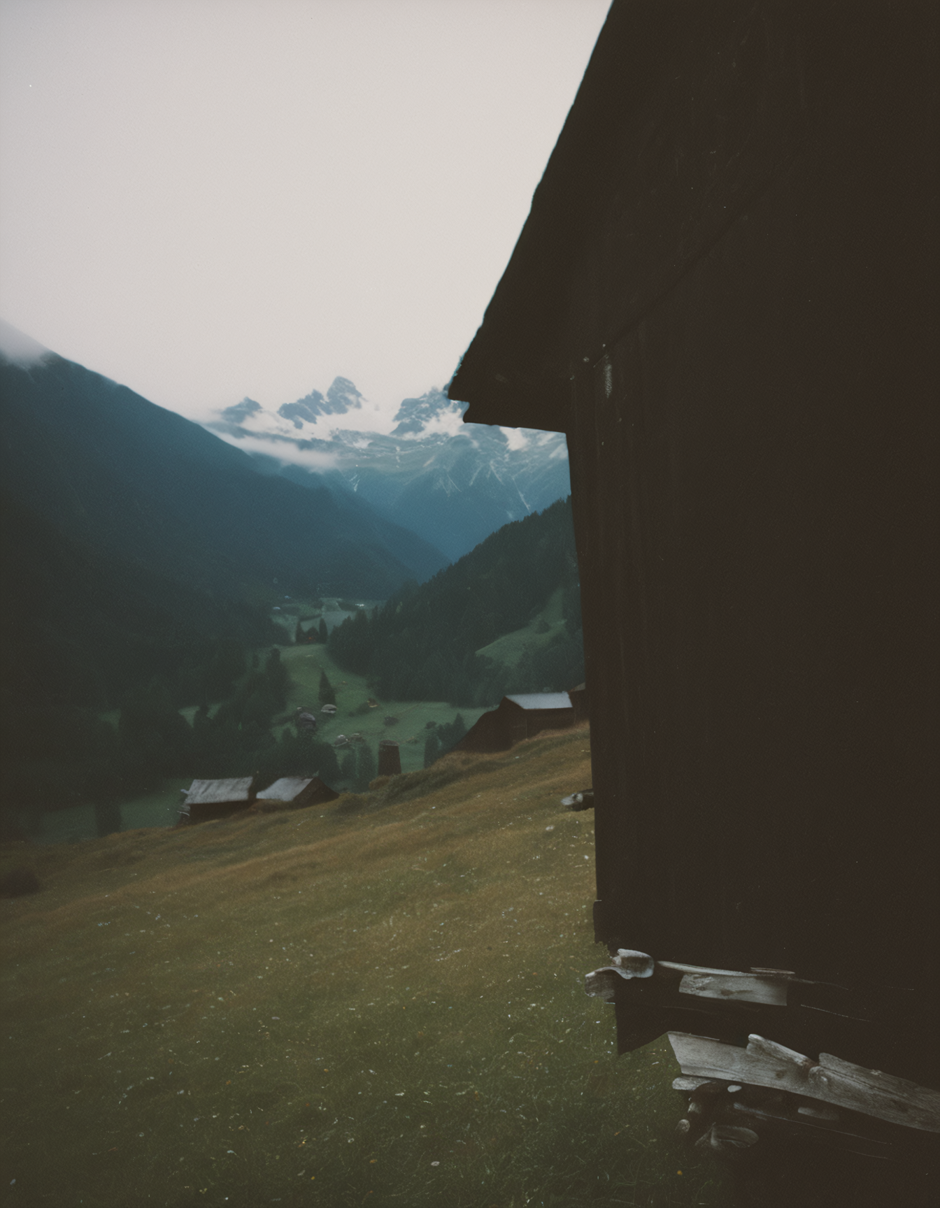 polaroid film photography, faded film, soft focus, film grain, an old barn in the austrian alps, 4k, uhd, masterpiece