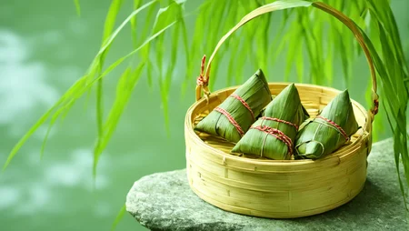 zongzi in the bamboo basket on the stone besides the river <lora:sdxl_zongzi_lora_duanwu_0_300:1.0>, beautiful, hd, 8k, (photographic:1.5), magnificent, grandiose, mac os wallpaper